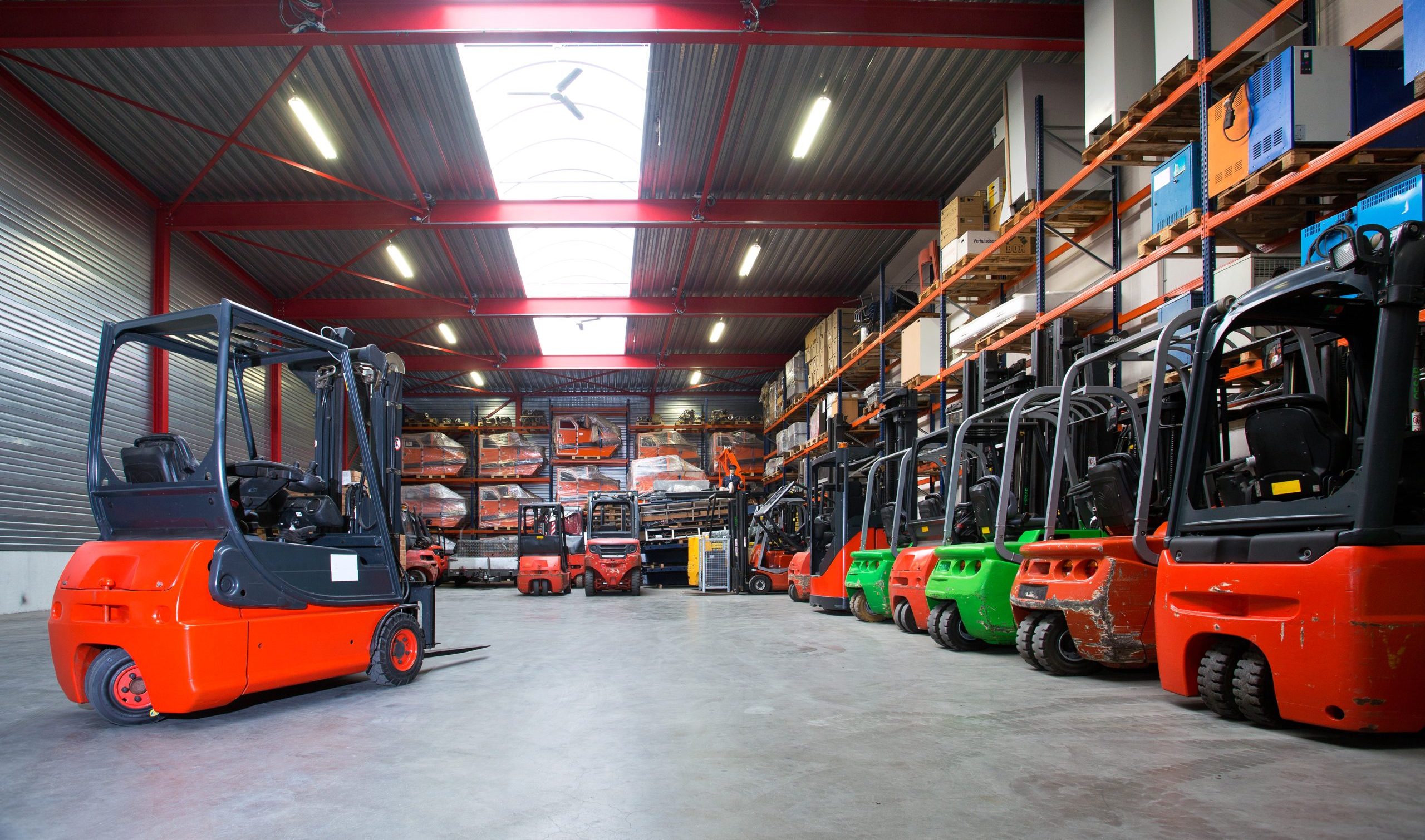 Forklift machinery in a row in warehouse