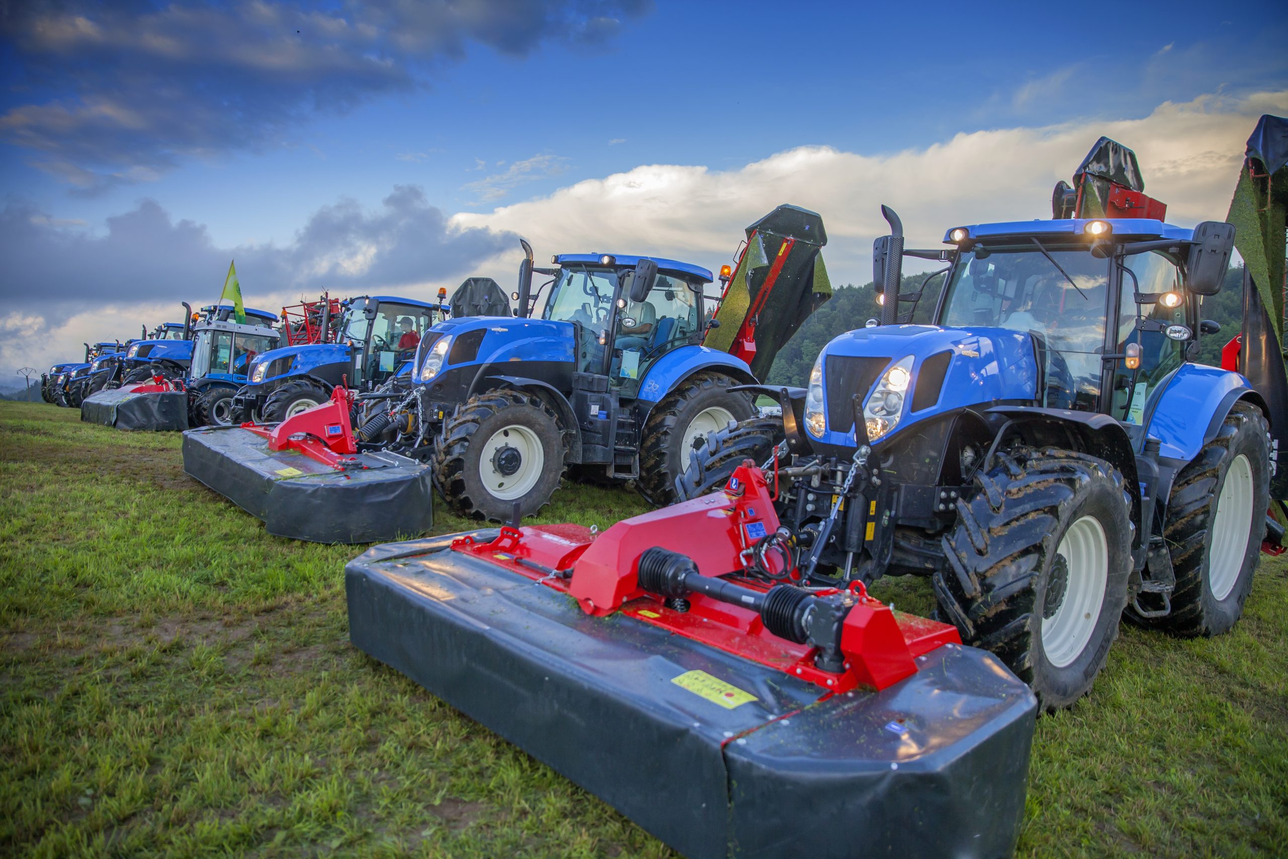 A row of agricultural machinery in a field