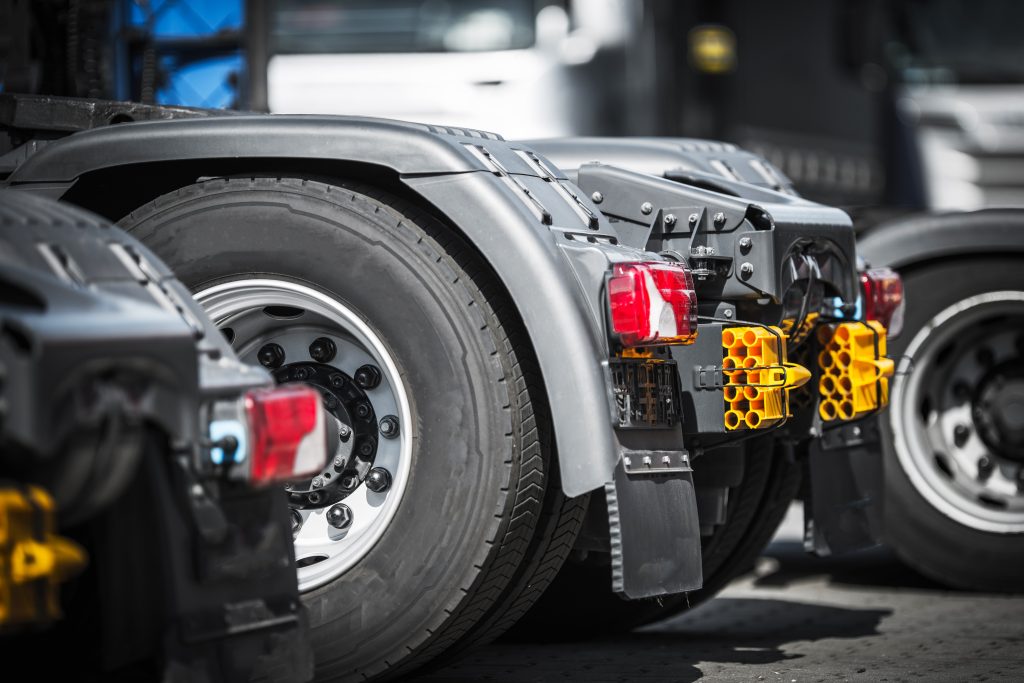 Semi Truck Tractors Closeup Photo. Tracking and Transportation Concept.